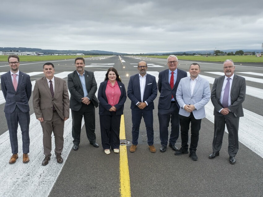 Glasgow City Region Cabinet pictured on the runway at Glasgow Airport.  
Cabinet Chair and Leader of Glasgow City Council, Susan Aitken (centre), with Kam Jandu, CEO AGS Airports (centre right).